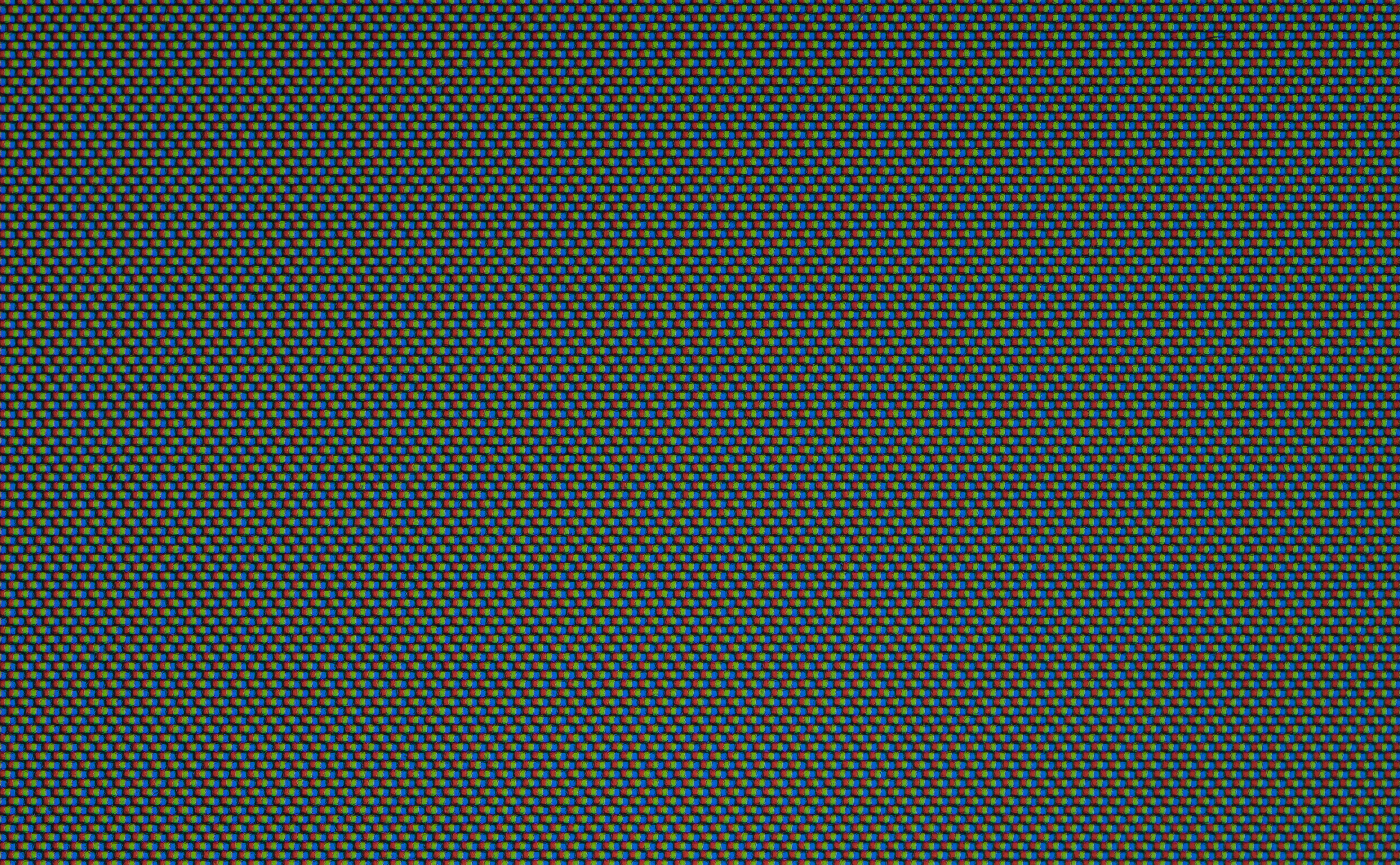 Microscopic close-up of an LCD display showing red, green, and blue subpixels.